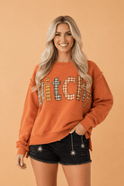 Halloween sweatshirt, witchy aesthetic clothing, plaid patchwork top, exposed seam sweatshirt, burnt orange autumn sweater, spooky season apparel, women's fall fashion.