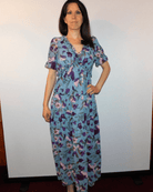 Boho floral dress, V-neck maxi dress, summer floral gown, ruffle maxi dress, wrinkle-resistant dress, breathable floral dress, bohemian chic style, high waist maxi, sky blue floral dress, fiery red maxi.