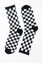 Checkered socks, black and white socks, quarter length socks, streetwear accessories, high stretch knit socks, checkered pattern footwear, comfortable crew socks.