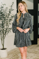 Black tiered dress, chiffon mini dress, leopard print dress, ruffle neck dress, women’s boutique fashion, flowy long sleeve dress, elastic waist dress.