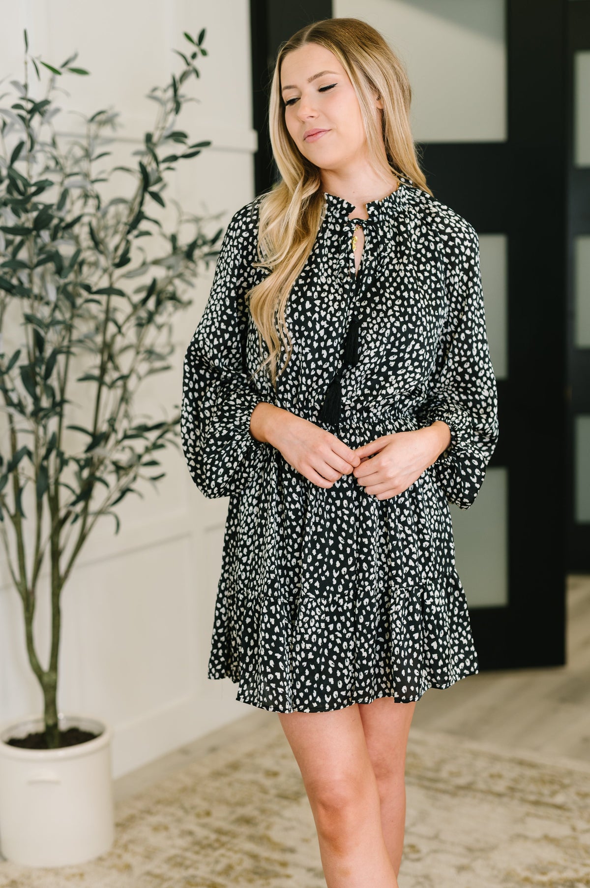Black tiered dress, chiffon mini dress, leopard print dress, ruffle neck dress, women’s boutique fashion, flowy long sleeve dress, elastic waist dress.