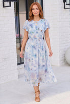 floral midi dress, wedding guest dress, watercolor print dress, flutter sleeve dress, chiffon midi dress, pastel summer dress, garden party outfit, feminine midi dress