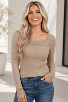 Beige ribbed long sleeve top with lace-trimmed square neckline and cuffs.