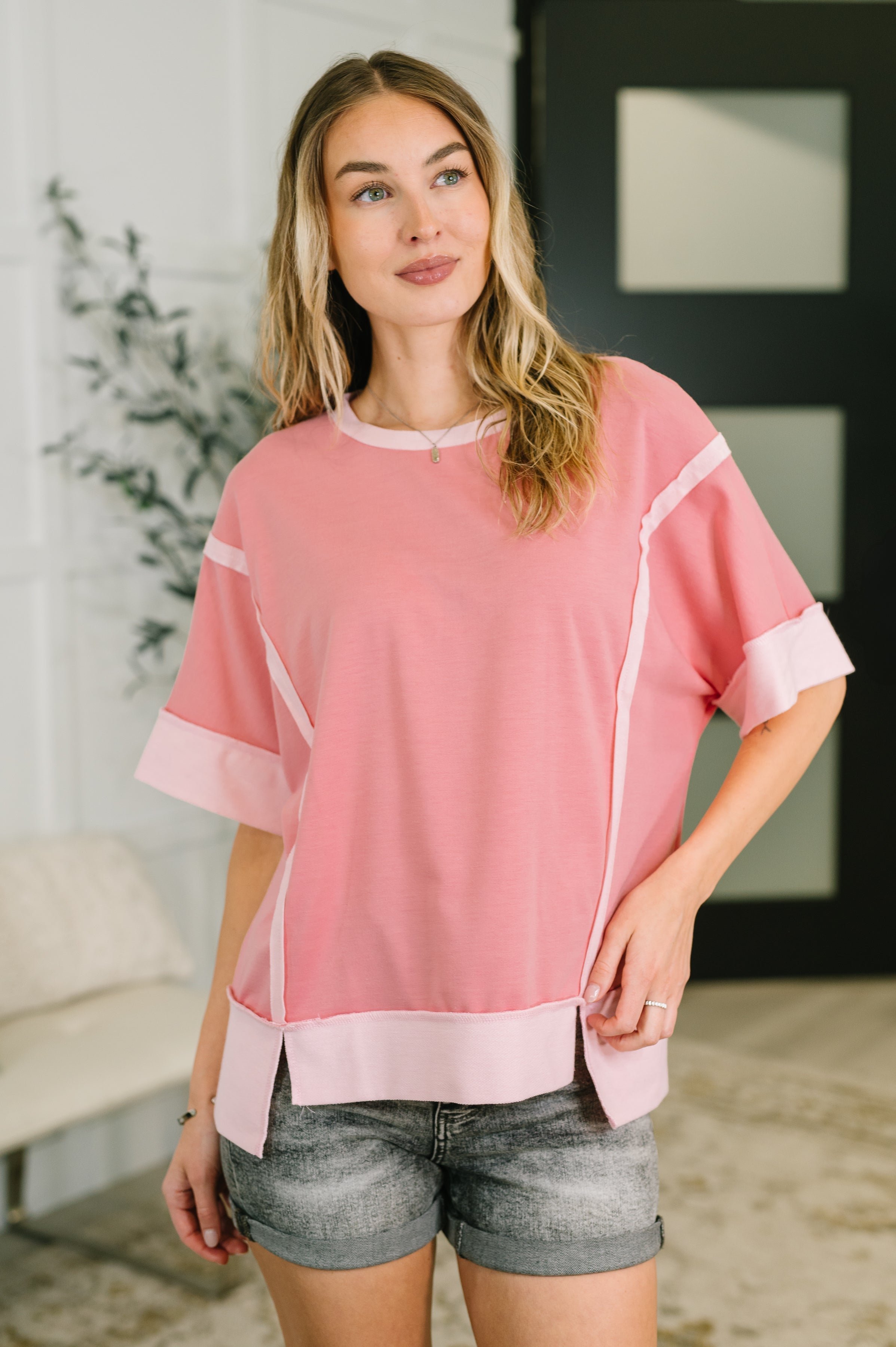 pink french terry top, exposed seam shirt, women’s casual pink top, drop shoulder lounge top, high low hem top, comfortable pink sweatshirt, boutique casual wear