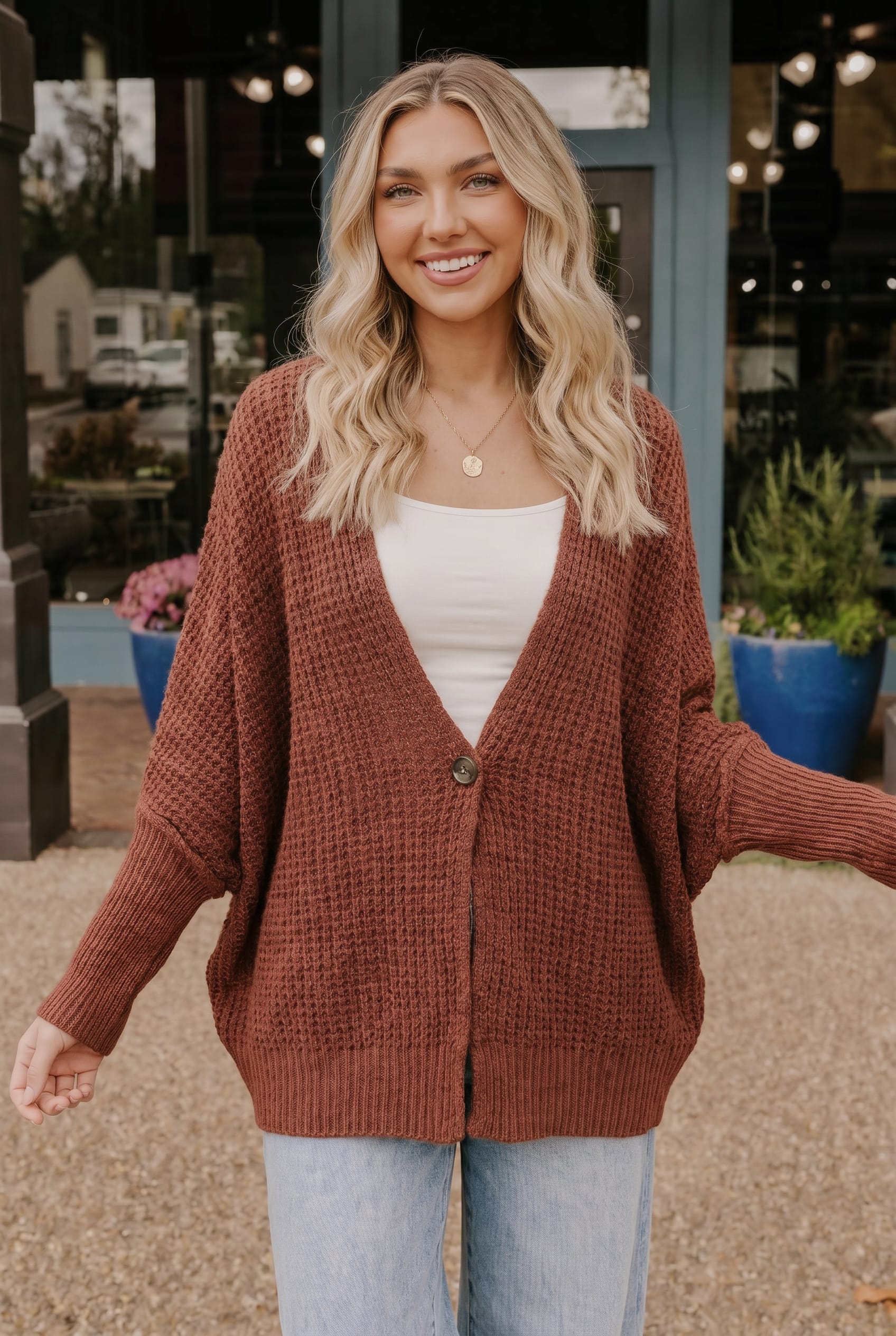 Rust cardigan, oversized cardigan, waffle knit sweater, women's fall fashion, button front cardigan, autumn layering piece, cozy knitwear, rust knit sweater.