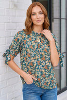 Teal floral blouse, ditsy print top, tie sleeve blouse, ruffle neck top, women’s puff sleeve shirt, boho floral blouse, flowy teal top, spring fashion 2026