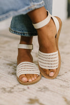 Bone flat sandals, woven summer shoes, ankle strap sandals, women's casual footwear, neutral sandals, PU leather flats, comfortable summer sandals, chic beach footwear.