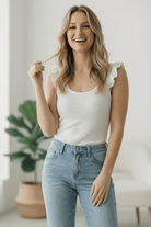 ivory bodysuit, ruffle sleeve bodysuit, ribbed knit bodysuit, feminine white top, stretchy bodysuit, scoop neck bodysuit, romantic boutique top, sleeveless ruffle bodysuit