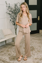 Women's loungewear, two-piece lounge set, cocoa matching set, jersey knit pajamas, high-waisted lounge pants, comfortable travel outfit, neutral loungewear.