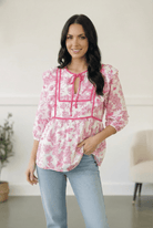 floral peplum blouse, pink floral top, tie-neck blouse, feminine brunch outfit, women's lightweight floral top, contrast trim blouse, spring fashion, Garden Party top