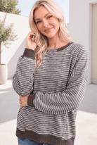 Relaxed raglan pullover with mocha and cream stripes, featuring ribbed cuffs and a casual fit.