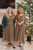 Floral maxi dress with ditsy print, square neckline, and 3/4 length sheer sleeves.