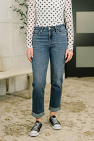 Mid-rise boyfriend jeans in dark indigo with a relaxed fit and cuffed hem.