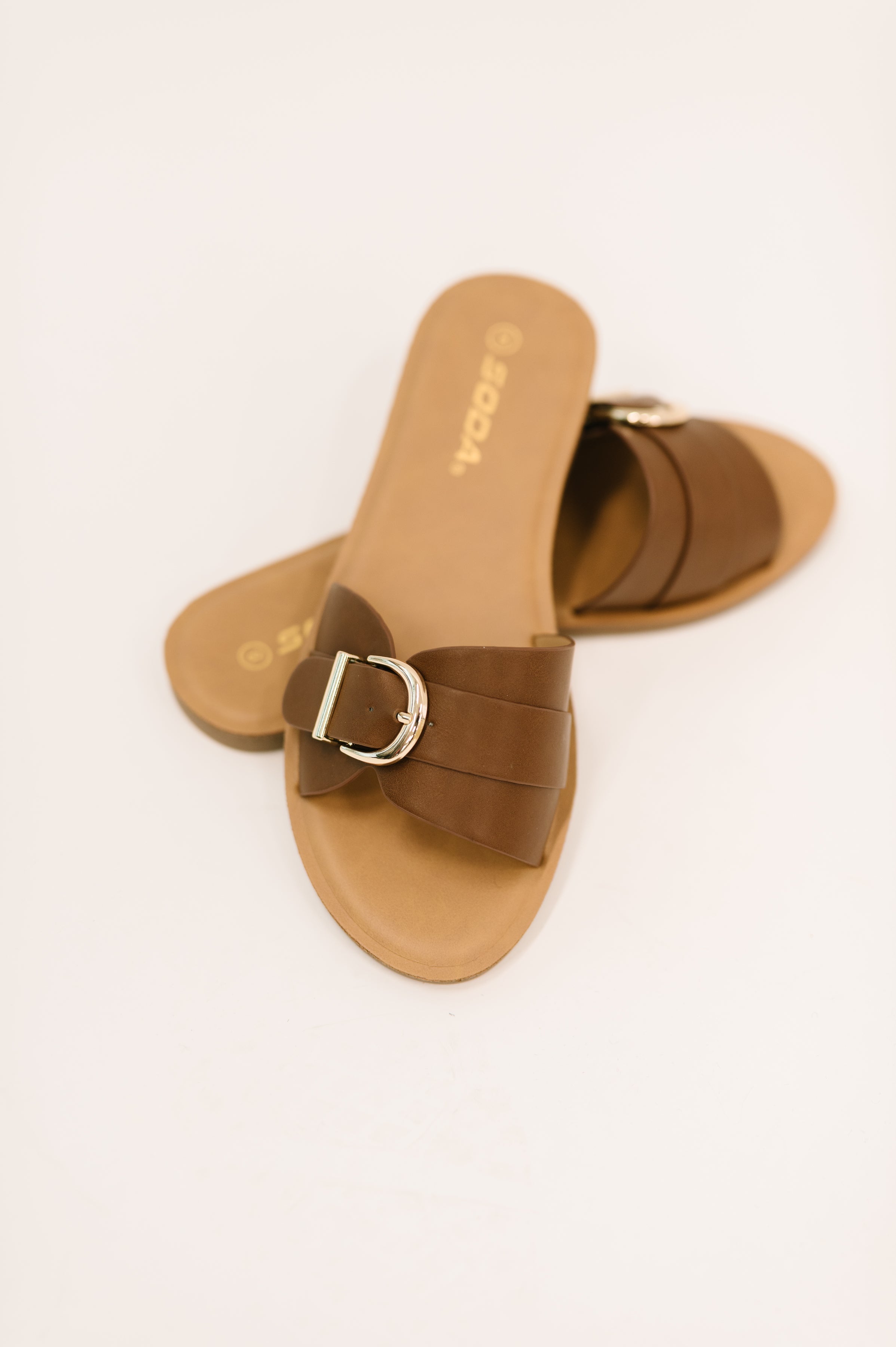 Women's slip-on sandals, faux leather slides, buckle sandals, comfortable summer shoes, gold buckle flats, tan slide sandals, everyday footwear.