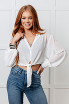 Woman wearing a white Tie Front Button Up Shirt
