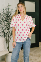 Puff sleeve blouse, notched neck top, crinkle woven blouse, smocked bust top, romantic balloon sleeve, ruffled V-neck top, polka dot feminine blouse, structured women's top, trendy spring fashion, pink and white blouse.