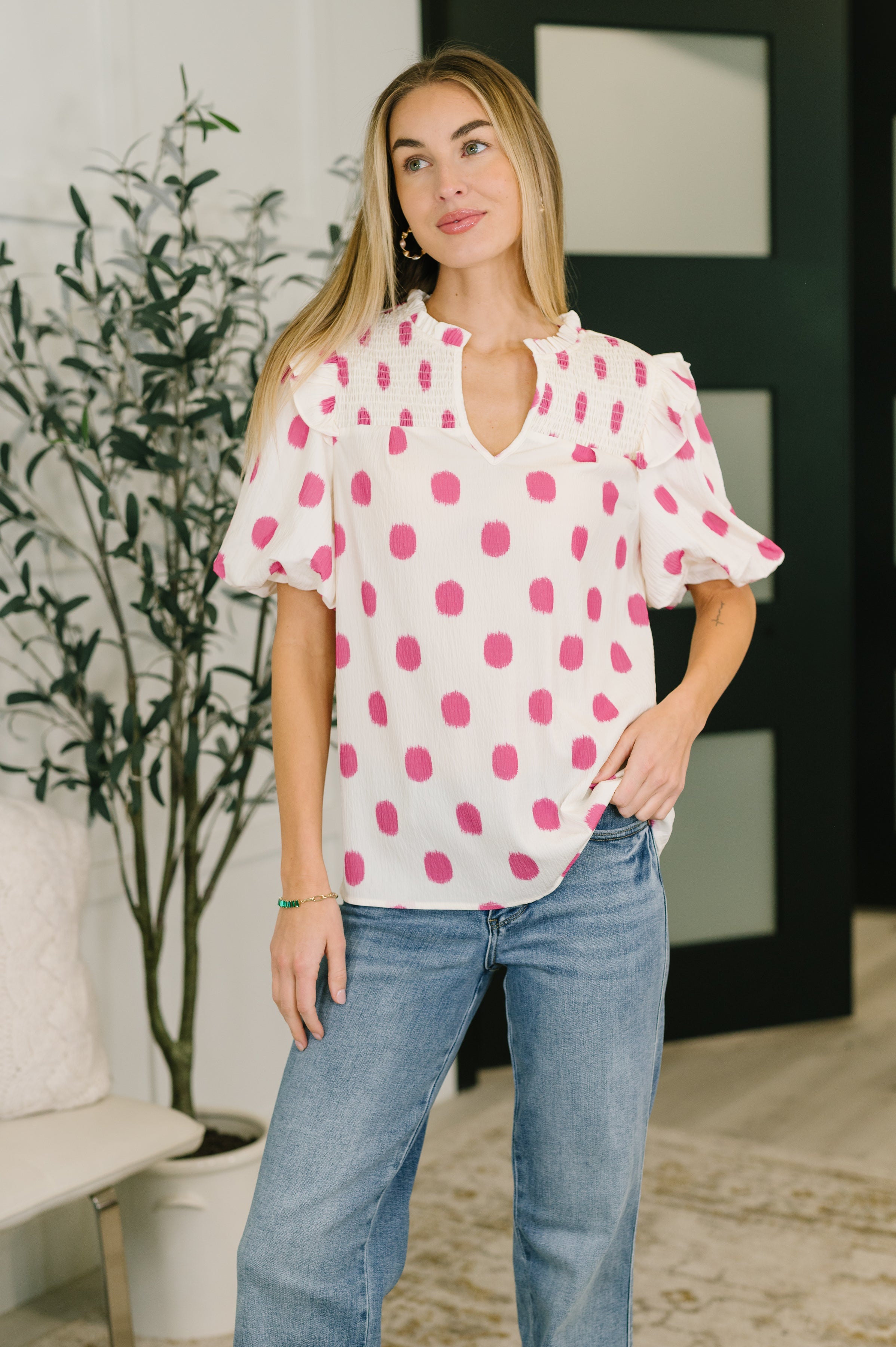 Puff sleeve blouse, notched neck top, crinkle woven blouse, smocked bust top, romantic balloon sleeve, ruffled V-neck top, polka dot feminine blouse, structured women's top, trendy spring fashion, pink and white blouse.