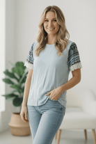 Boho tee, women's lace top, printed sleeve shirt, relaxed fit tee, boutique clothing, soft feminine tops, casual boho style, polyester spandex blend, lightweight summer top.