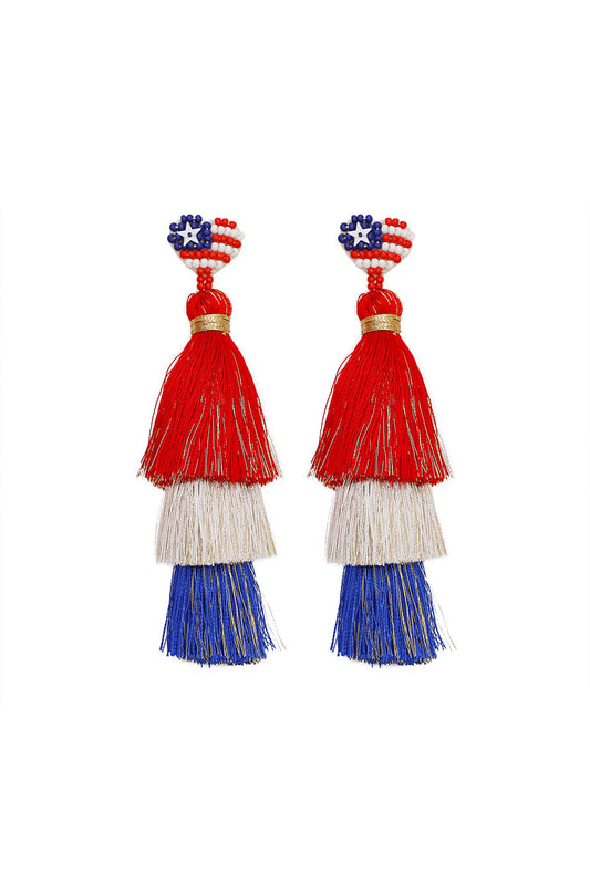 Pair of tassel earrings with red, white, and blue colors on a white background