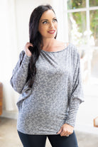 Grey dolman top with ivory floral pattern and 3/4 sleeves.